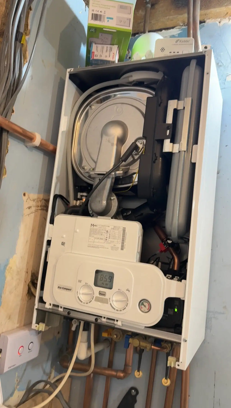 Internal view of a Main Eco Compact combi boiler during a professional London installation by ODS Plumbing & Construction.