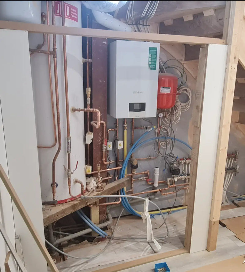 Large-scale heating system with Vaillant boiler and unvented hot water cylinder installation in London by ODS.